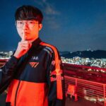 Faker holding up hush sign in T1 uniform at MSI 2022